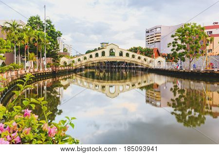 MALACCA, MALAYSIA - AUGUST 13, 2016: An arch bridge over the Malacca river near Jambatan Old Bus Station. Malacca City was listed as a UNESCO World Heritage Site on 7 July 2008