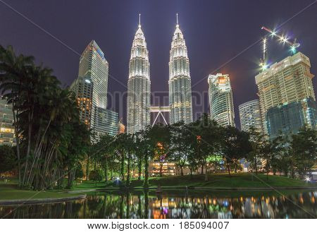 KUALA LUMPUR, MALAYSIA - AUGUST 13: Petronas Twin Towers at night on August 13, 2016 in Kuala Lumpur. Petronas Twin Towers were the tallest buildings (452 m) in the world from 1998 to 2004.