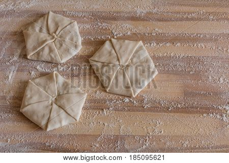 Homemade pastries with cheese on wooden board
