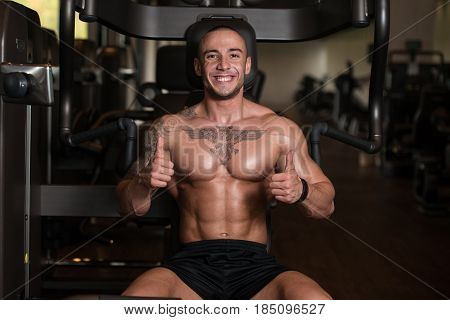 Muscular Man Showing Thumbs Up