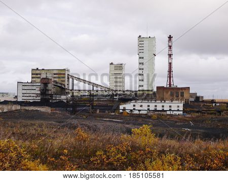 Autumn tundra view of coalmine building in northern russia town