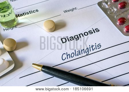 Diagnosis cholangitis written in the diagnostic form and pills