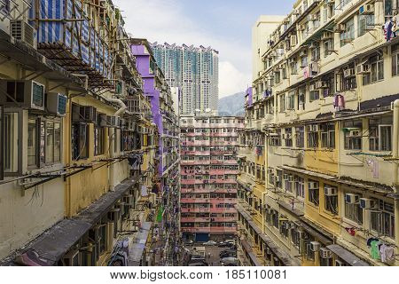 Old houses surrounded modern skyscrapers in Hong Kong. Hong Kong is popular tourist destination of Asia and leading financial centre of the world.