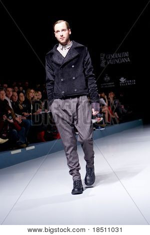 VALENCIA, SPAIN - FEBRUARY 2:  A model on the catwalk wearing a Georgina Vendrell design for the Valencia Fashion Week on February 2, 2010 in Valencia, Spain.