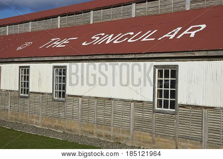 PUERTO NATALES, CHILE - APRIL 10, 2017: Historic buildings of a former meat refrigeration plant that have been renovated and converted into a luxury hotel.