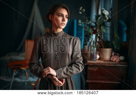 Beautiful female poseur in art studio