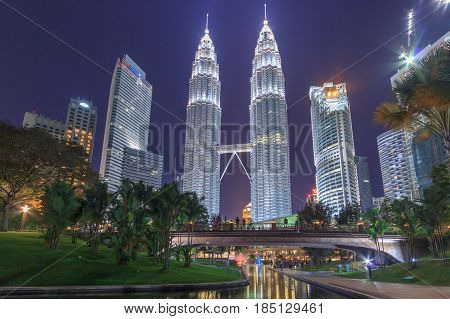 KUALA LUMPUR, MALAYSIA - AUGUST 13: Petronas Twin Towers in blue hour on August 13, 2016 in Kuala Lumpur. Petronas Twin Towers were the tallest buildings (452 m) in the world from 1998 to 2004