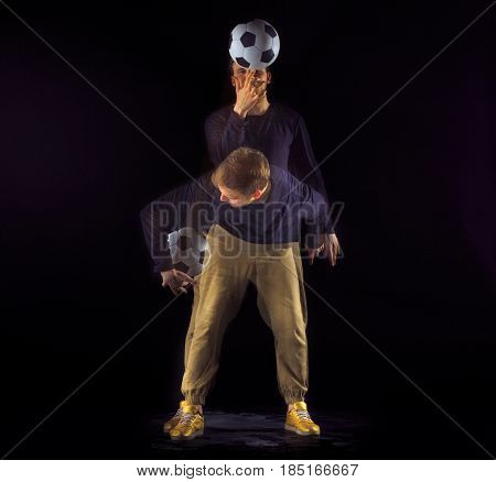 A portrait of a fan with ball on gray studio background. Freestile concept. Stroboscope shooting technique