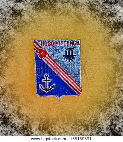 USSR - circa 1977: a badge with the coat of arms of the city of Novorossiysk, Krasnodar region from the series 