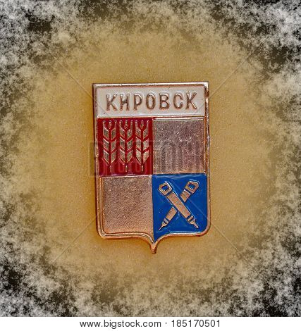 USSR - circa 1977: Badge with the coat of arms of the city of Kirovsk, Murmansk region from the series 