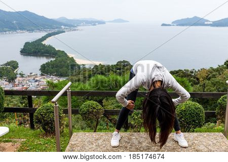 Woman upside down and viewing of Amanohashidate in Kyoto