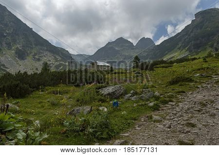 Mountain overgrown with coniferous forest, glade and rest-house toward Maliovitza peak in Rila 

mountain, Bulgaria