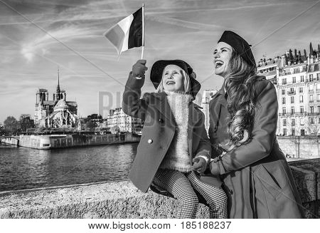 Stylish Mother And Child Travellers In Paris, France Rising Flag