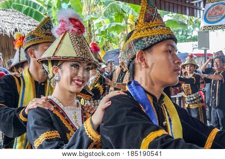 Penampang,Sabah-May 30,2016:Group of Sabah,Borneo Kadazandusun ethnic in their traditional costumes performs traditional dance during Harvest Festival at Penampang,Sabah,Malaysia