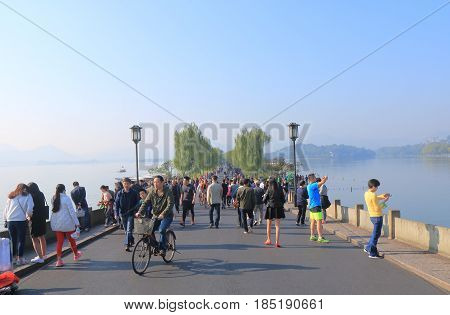 HANGZHOU CHINA - NOVEMBER 5, 2016: Unidentified people visit Broken bridge in West lake.