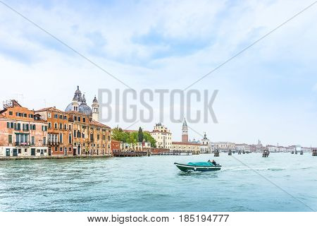 Venice Italy - April 27 2017: Beautiful Venice residential style beside Grand Canal with a boat in Venice Italy.