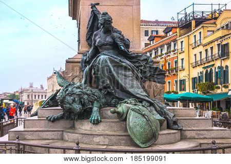 Venice Italy - April 27 2017: Metal statue of a girl on the base of The Victor Emmanuel II Monument in Venice Italy.