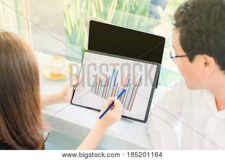 Businesswoman explain and lecture graph of growing our business of company to boss