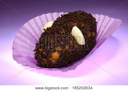 Grebeaud chocolate chip cookie mouse in purple crepe paper and background