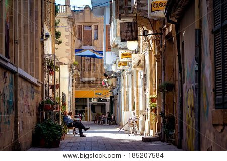 NICOSIA CYPRUS - MARCH 24 2017: View through the Sokratous street and the intersection with Ledra street in the old town of Nicosia