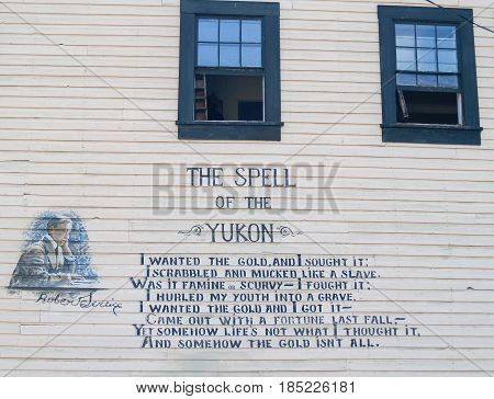 Dawson City, Canada - August 4, 2008; Poetry of Robert Service on wall of Dawson City building TheSpell of the Yukon