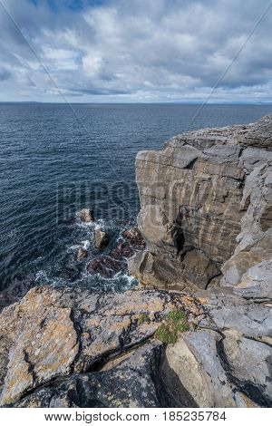 A view of the cliffs edge in Doolins Bay, The Burren, County Clare, Ireland