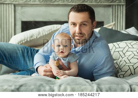 Happy dad with a little daughter of European appearance