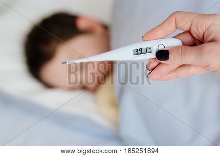 Thermometer To Measure The Heat Temperature Of A Sick Child