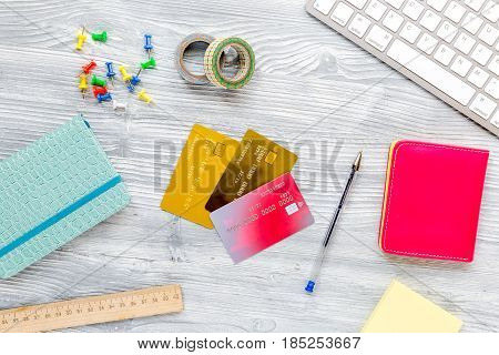 scolarship set with notebook, keyboard and cards on white desk background top view