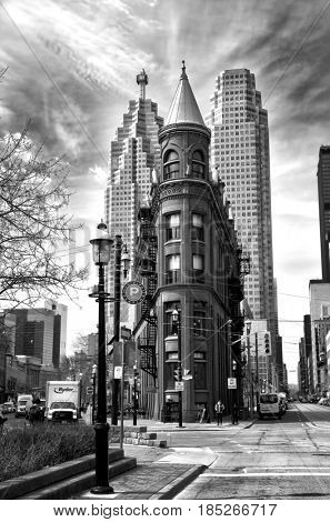 TORONTO CANADA JULY 10, 2017:  Gooderham Building is a historic landmark of Toronto, Ontario, Canada and is the focal poin in black and white