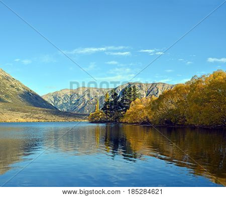 Lake Pearson & The Southern Alps of New Zealand's South Island in brilliant Autumn colours.