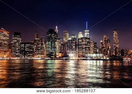 New York City Manhattan Downtown Skyline On Night Skyscrapers Illuminated Over Hudson River Panorama