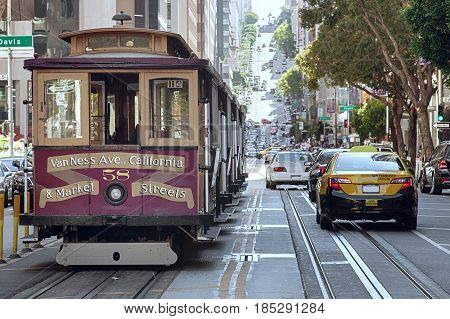 view of historical cable car on famous van ness ave  in san francisco