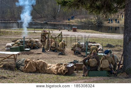 Gatchina, Russia - May 7, 2017: Historical reconstruction of the battles of World War II. Soldiers of the Red Army are firing mortars.