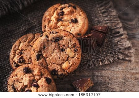 Chocolate chip cookies on dark old wooden table with place for text. freshly baked. Selective Focus with Copy space.