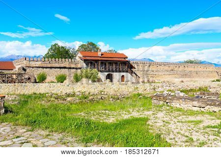 Panorama view of Alaverdi orthodox monastery in Kakhetia region in Georgia and snow peaks of Caucasus mountains