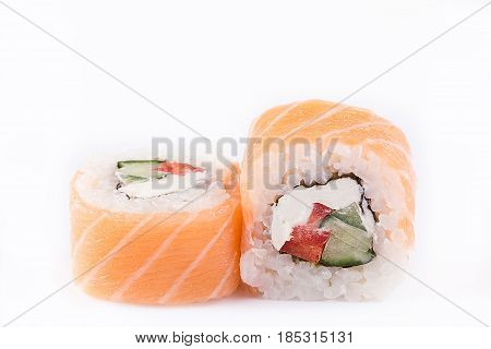Japanese Cuisine, Sushi Set: Salmon Roll With Cucumber, Pepper And Cheese On A White Background.