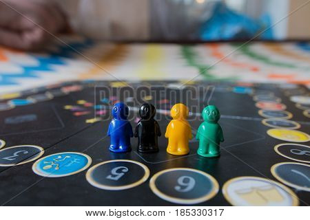 Multi-colored Chips For Tabletop Game In The Form Of Little Men