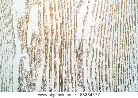 Texture of old board painted with white or cream paint and bronze or golden patina