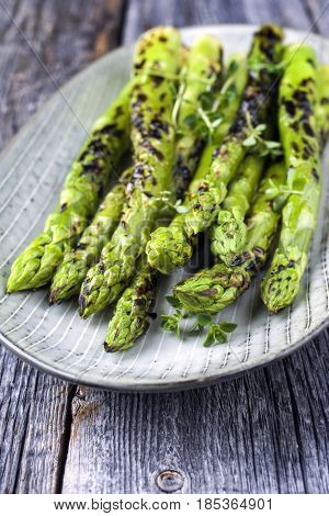 Barbecue green Asparagus as close-up on a plate 