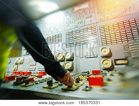 Hand On The Control Panel Of A Power Plant
