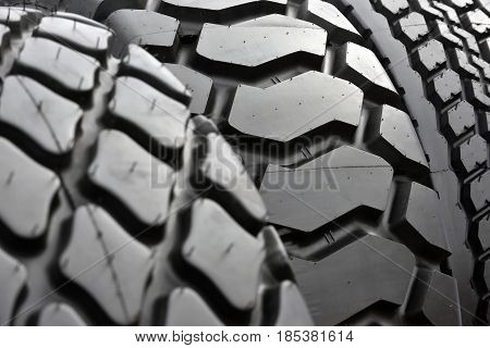 Big truck wheel a black tires closeup