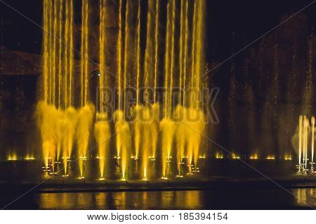 Multicolored Dancing Water Jet Fountain In The Dark