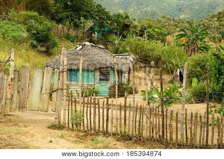 Wooden house in one of villages by the trail for the highest peak on Cuba Pico Turquino being in a mountain range Sierra Maestra on Cuba