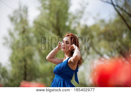 Dreammy romantic woman in outdoor photo in sunny summer day. Beautiful girl in springtime
