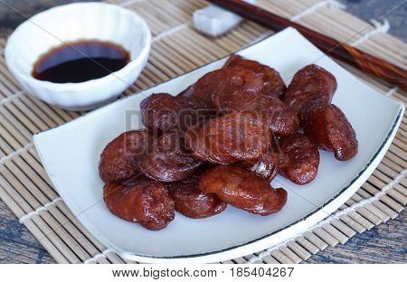 Fried chinese sausage sliced and soyu sauce