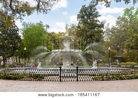 Savannah GA - March 27 2017: Forsyth Park is the largest park in Savannah's historic district and a famous tourist destination. The fountain dates to 1858 and is symbolic of Savannah.