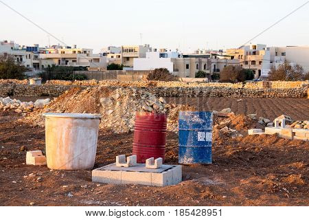 Construction material and activities in a field on the outskirts of Attard and Mosta Malta.