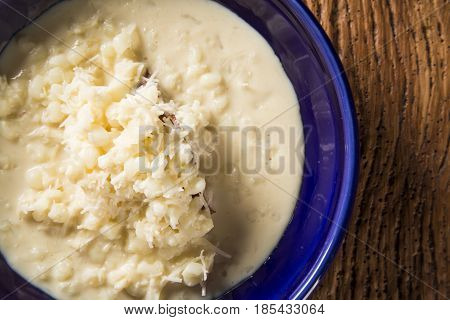 Brazilian Dessert Canjica Our Mungunza Of White Corn In Blue Bowl