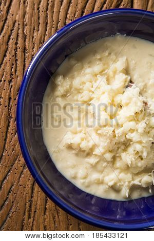 Brazilian Dessert Canjica Our Mungunza Of White Corn In Blue Bowl